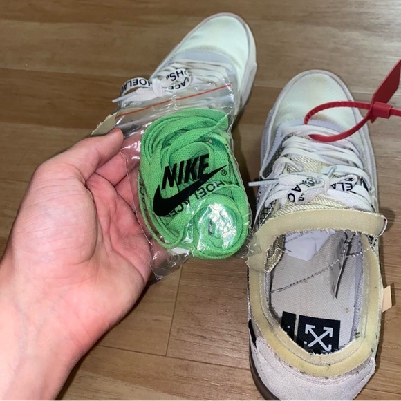 Nike White Cream Low-Top Sneakers with Black Swoosh and Red Zip Tie
